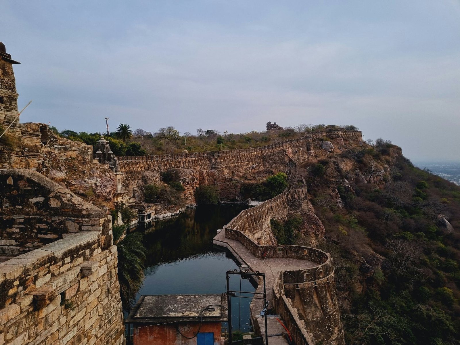 Chittorgarh Fort rampart above a pond
