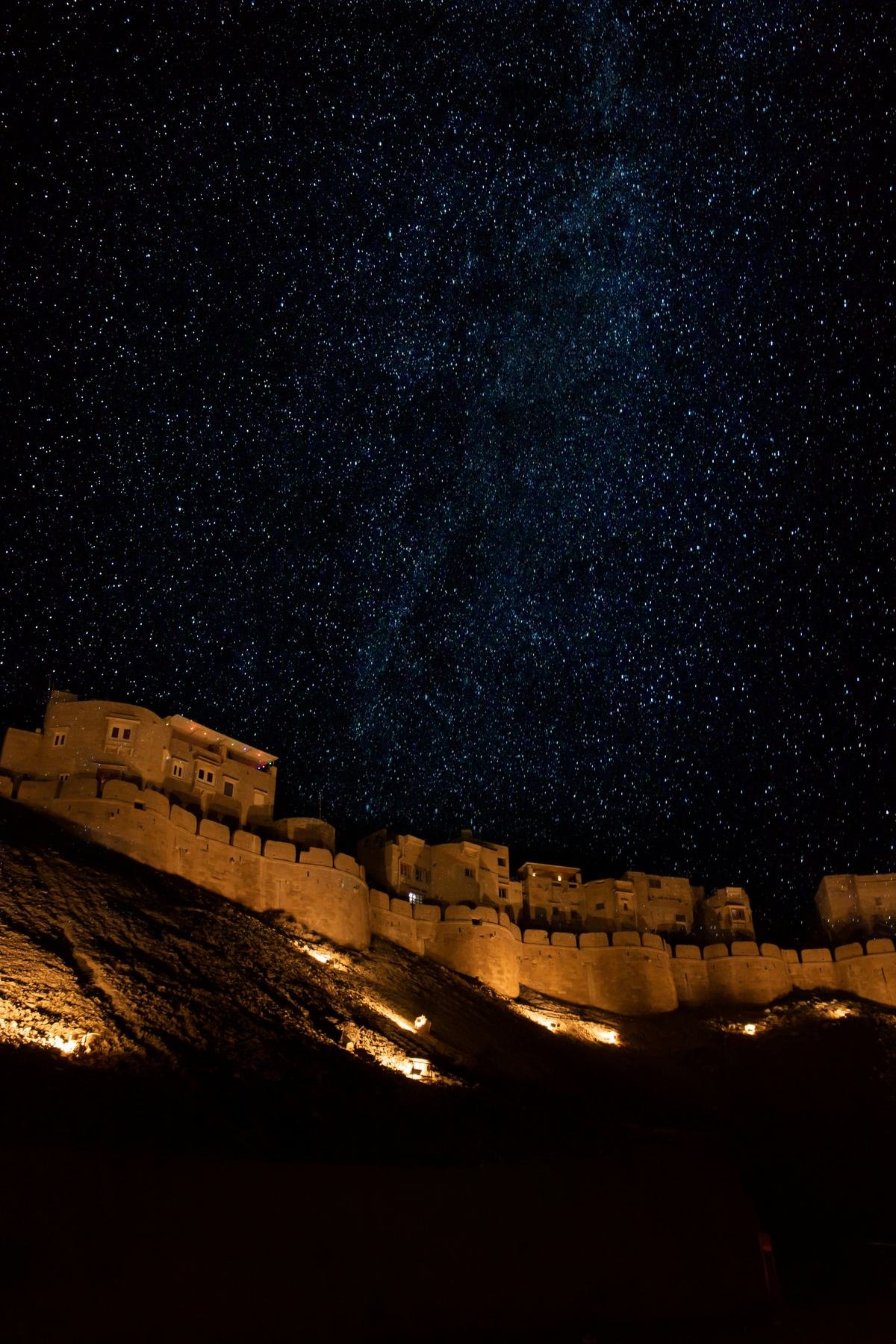 Jaisalmer Fort walls under a starry night sky